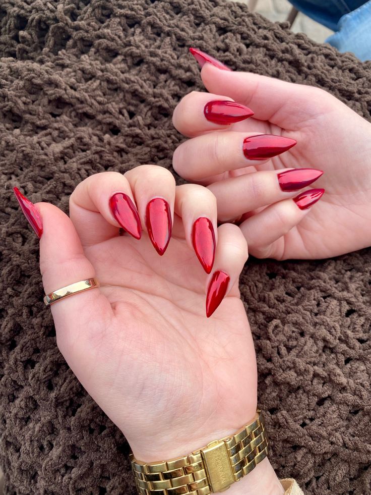 Gorgeous High-Gloss Red Stiletto Manicure: A Bold Statement of Style and Sophistication.