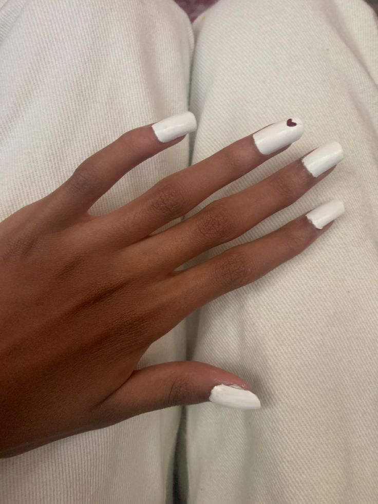 Elegant Chic White Nail Design with Playful Heart Accent