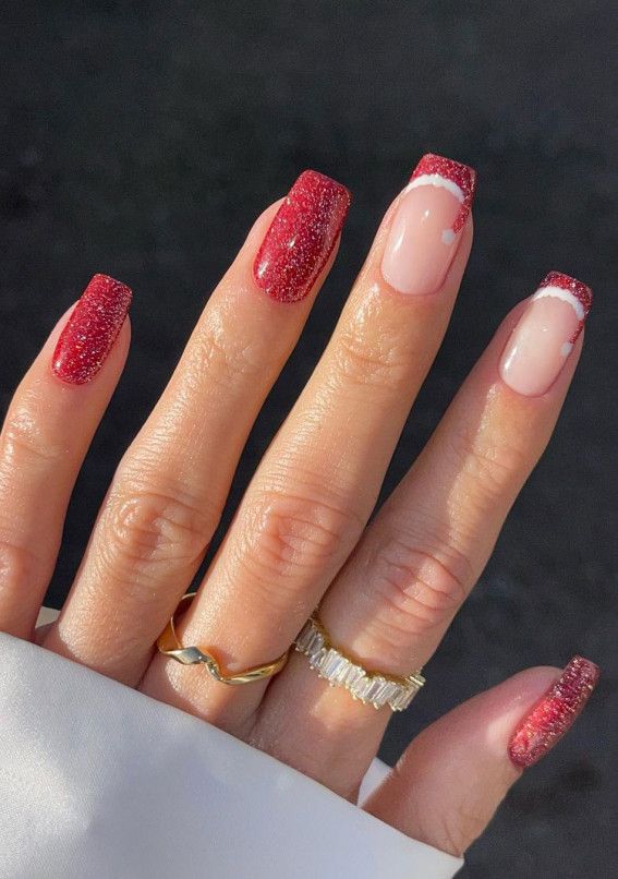 Chic Sparkly Red and Nude Nail Design with Glittery Tips and Elegant Embellishments