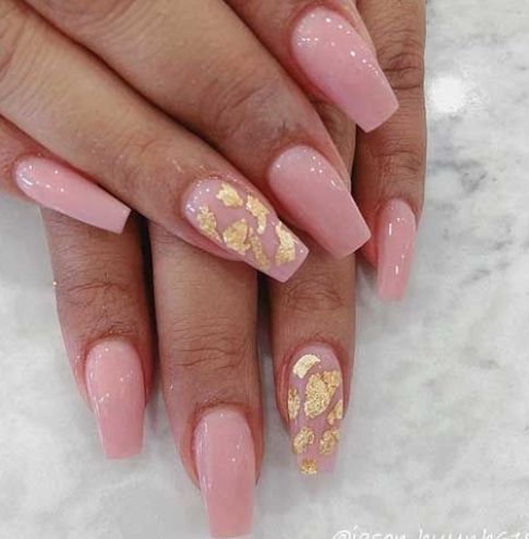 Sophisticated Soft Pink Nail Design with Delicate Golden Leaf Accents.