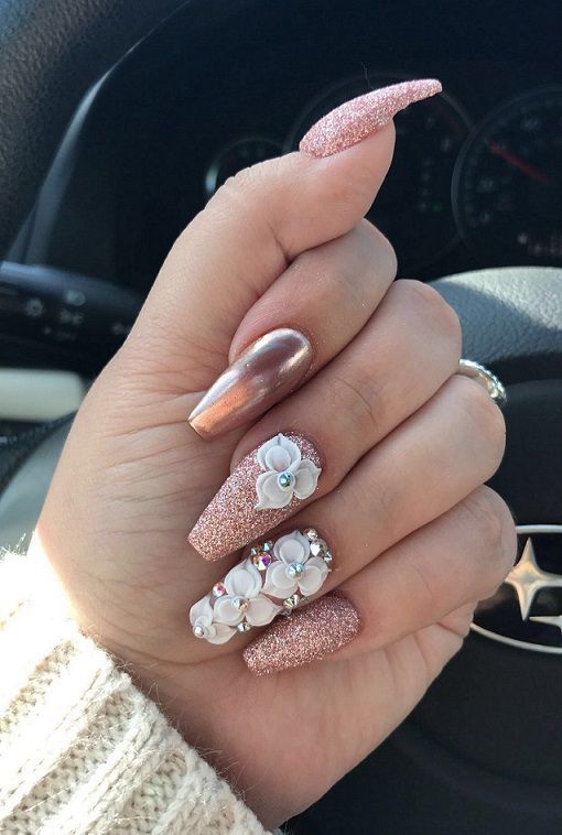 Glamorous Textured Nail Design with Sparkly Pink, Rose Gold, and 3D Floral Accents.