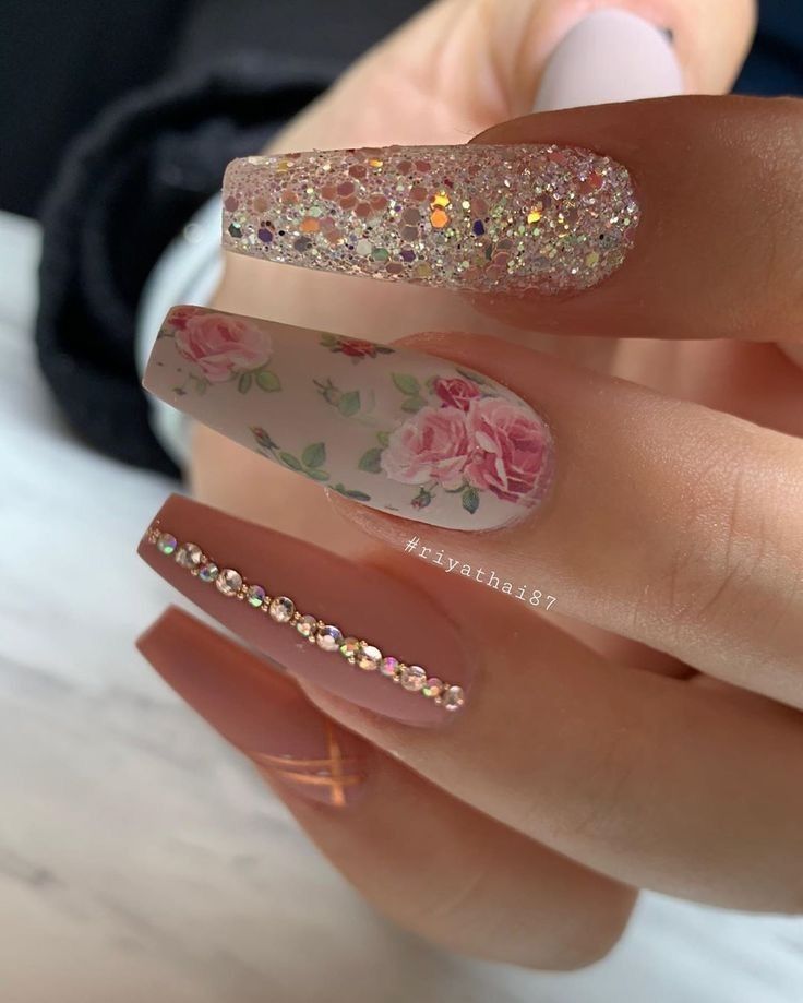 Elegant Nail Design Featuring Sparkling Textures and Floral Patterns