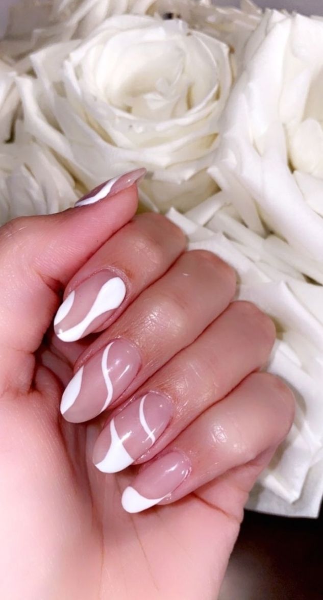 Chic Nail Design: Clear and White Polish with Wavy Tips and Rose Accents