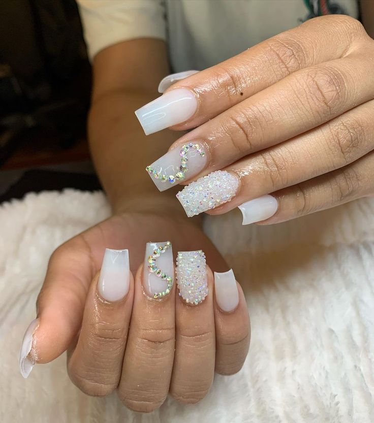 Glamorous Elegant Nail Design with Glossy White Tips and Sparkling Embellishments