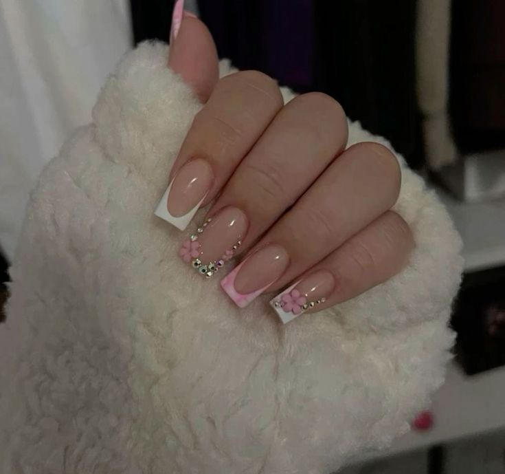 Elegant Neutral and Pastel Nail Design with Floral Accents and Sparkling Details