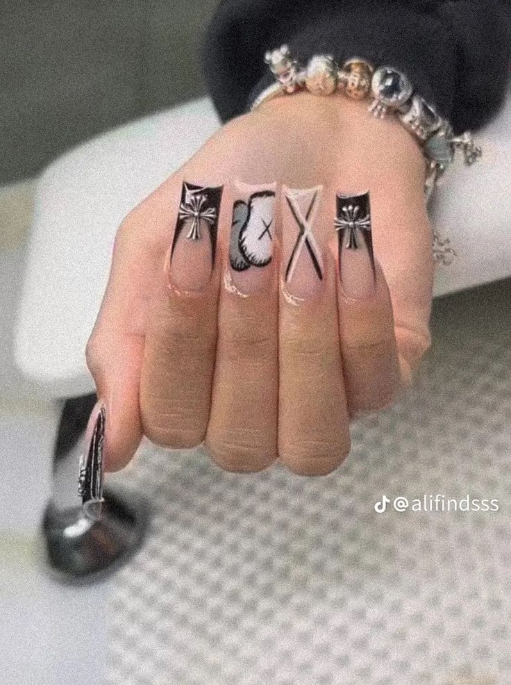 Bold Black and White Nail Art: Striking Designs on a Nude Base for a Modern Look.