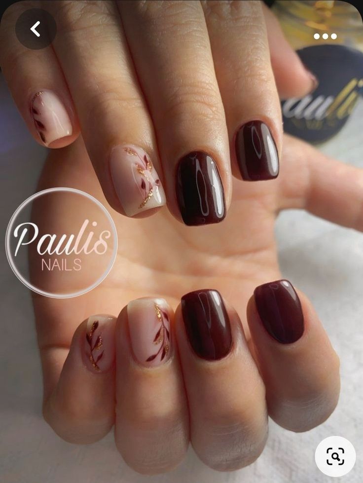 Elegant Nail Design: A Sophisticated Blend of Rich Colors and Delicate Floral Accents.