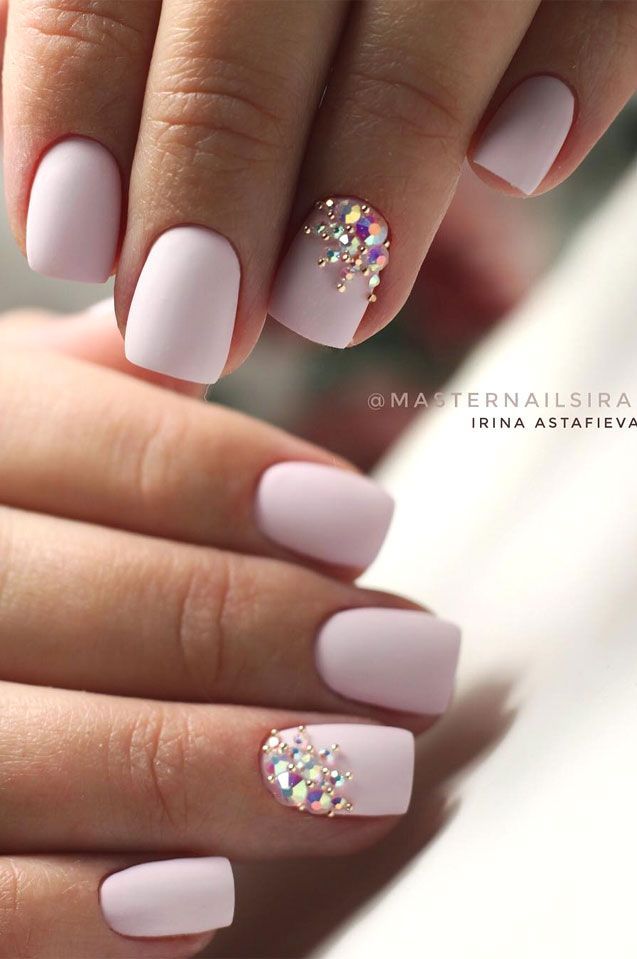 Elegant Soft Pastel Nail Design with Matte Finish and Iridescent Gem Accent.