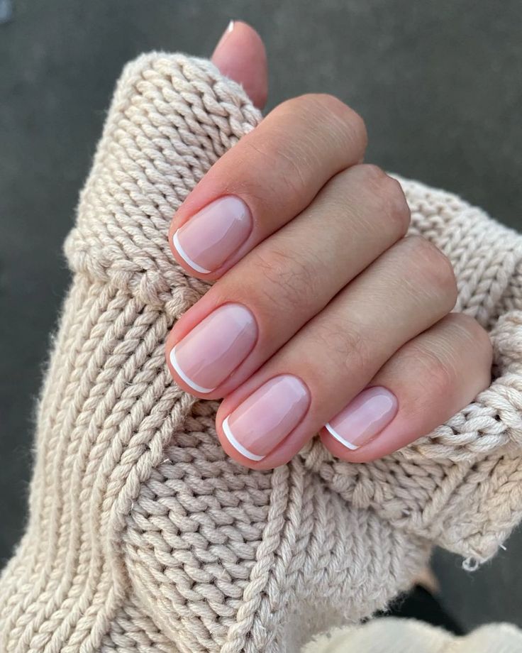 Timeless Elegance: Subtle White-Tipped Nude Nails for Any Occasion.