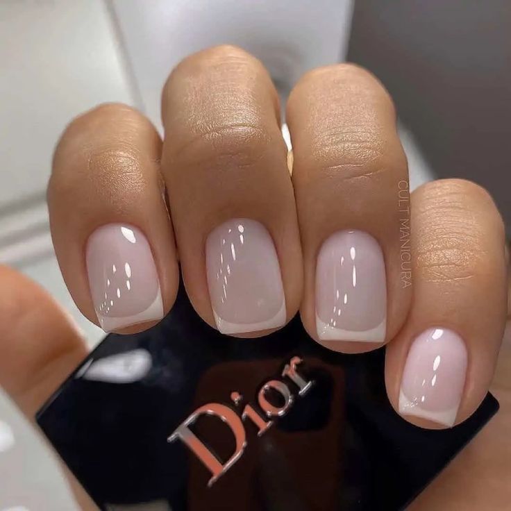 Stylish French Manicure: Chic Soft Pink Base with Classic White Tips for a Luxurious Look.