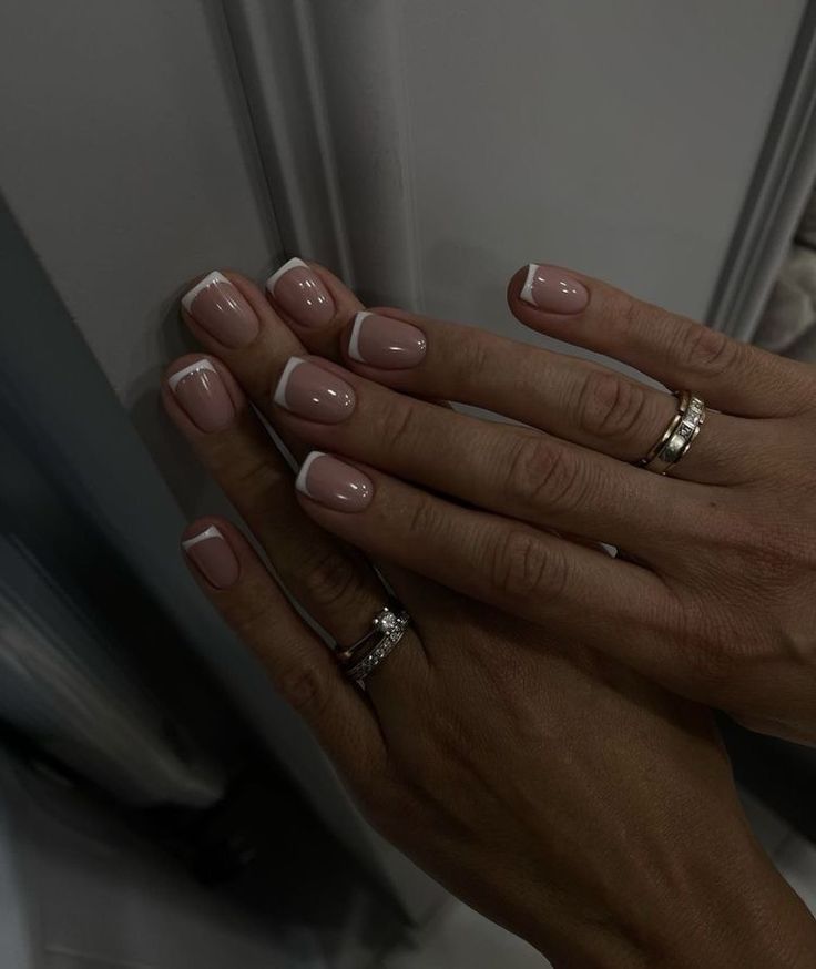 Timeless Elegant French Manicure with Shimmering Accents.