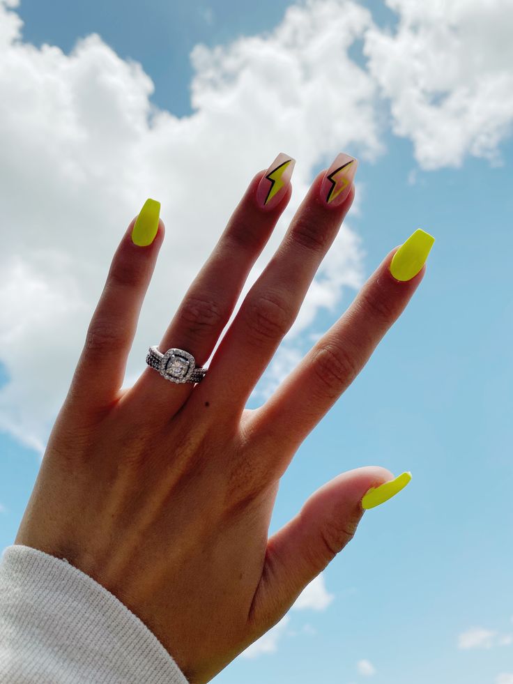 Bold Summer Nail Art: Vibrant Yellow with Striking Lightning Bolt Designs