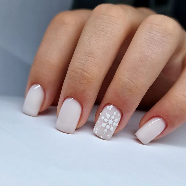 Elegant Ombre Nail Design: Nude to White with Floral Accents for Every Occasion