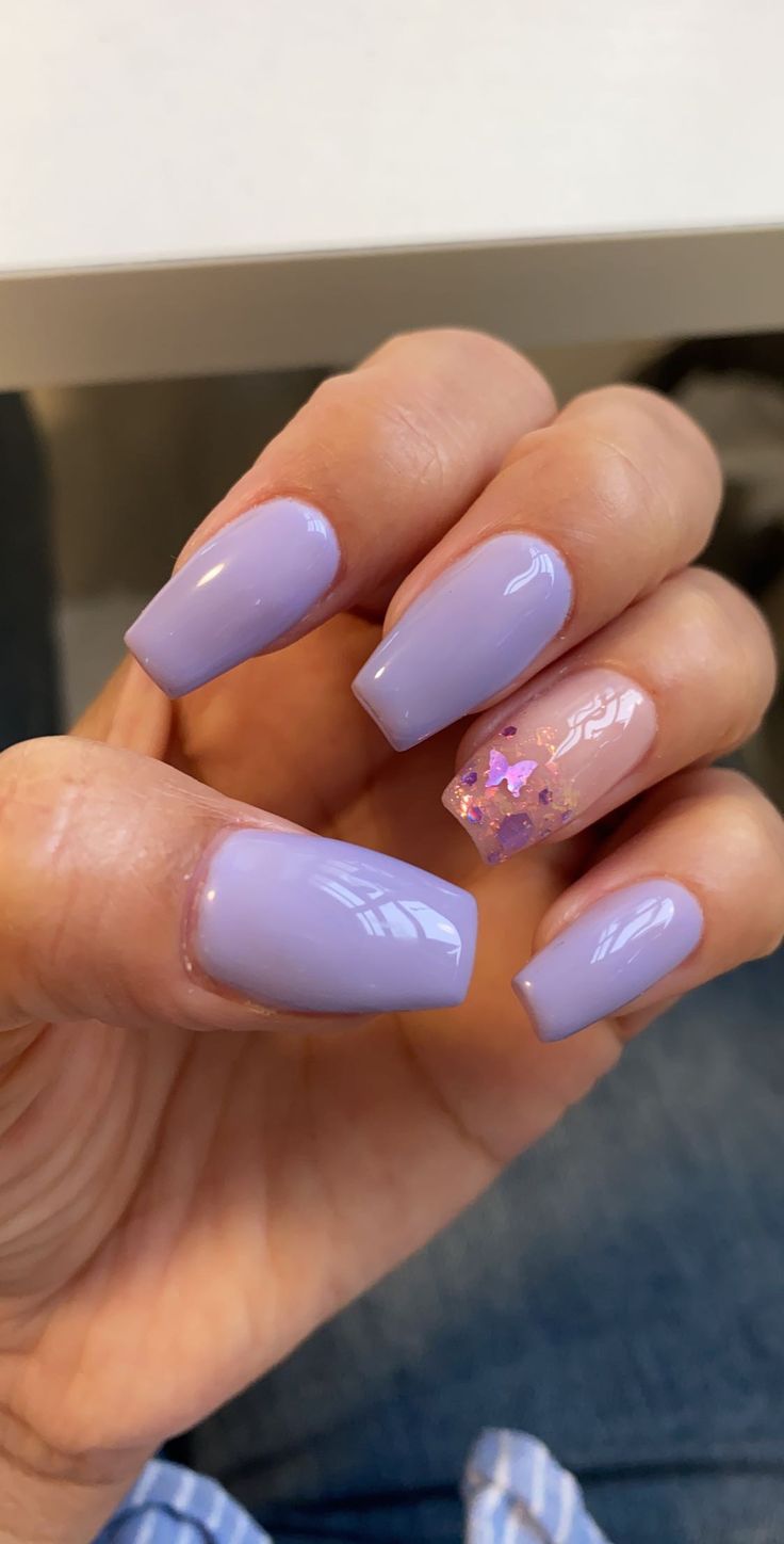 Chic Lavender Nail Design with Glossy Finish and Playful Pink Star Glitter Accent.