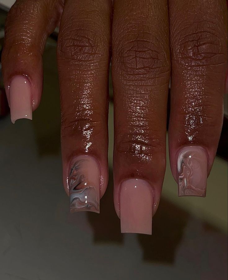 Chic Soft Pink and Marbled Nail Design for Modern Elegance.