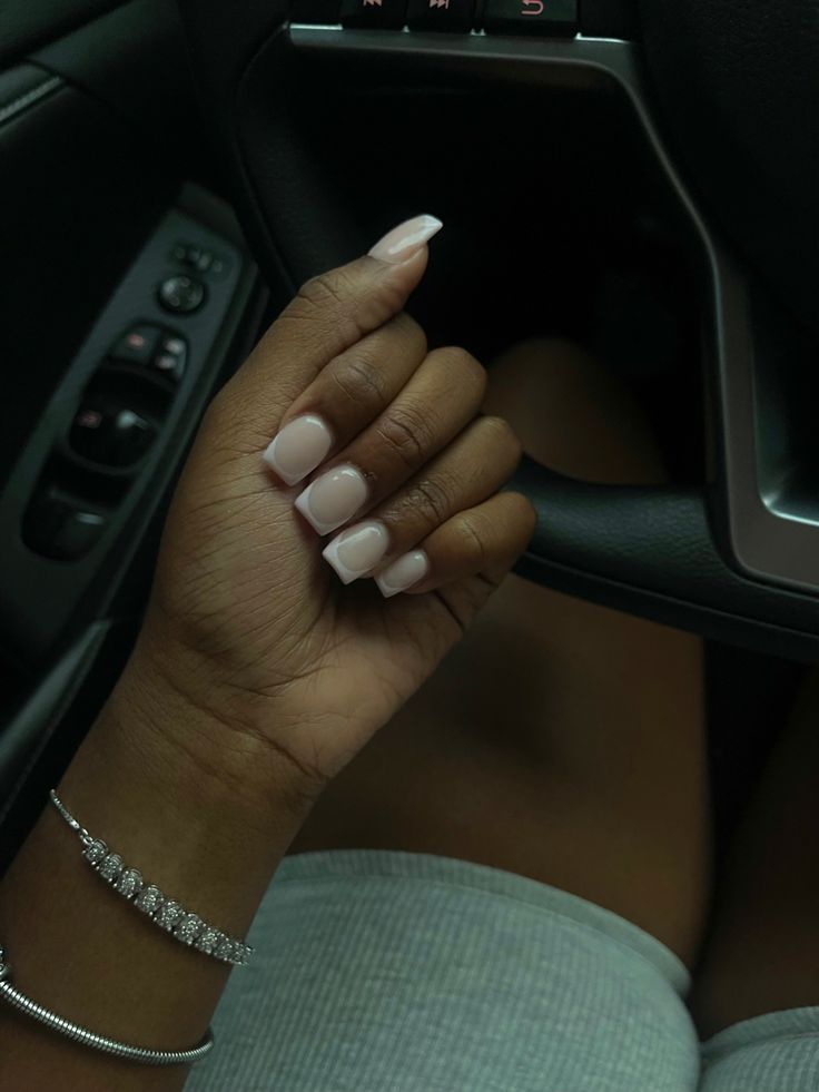 Sophisticated Elegant Nude Nail Design: Glossy Finish and Classic Shape for Any Occasion