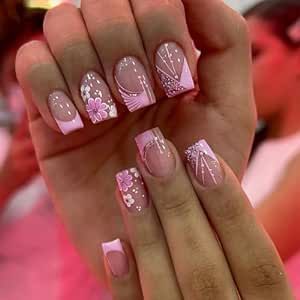 Charming Floral Pink Nail Design: Elegant French Tips for Any Occasion.