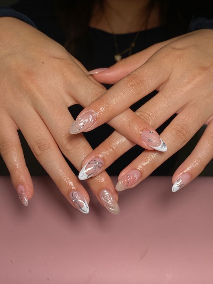 Sophisticated Elegant Nail Design: Soft Pinks with Striking White Tips and Intricate Details