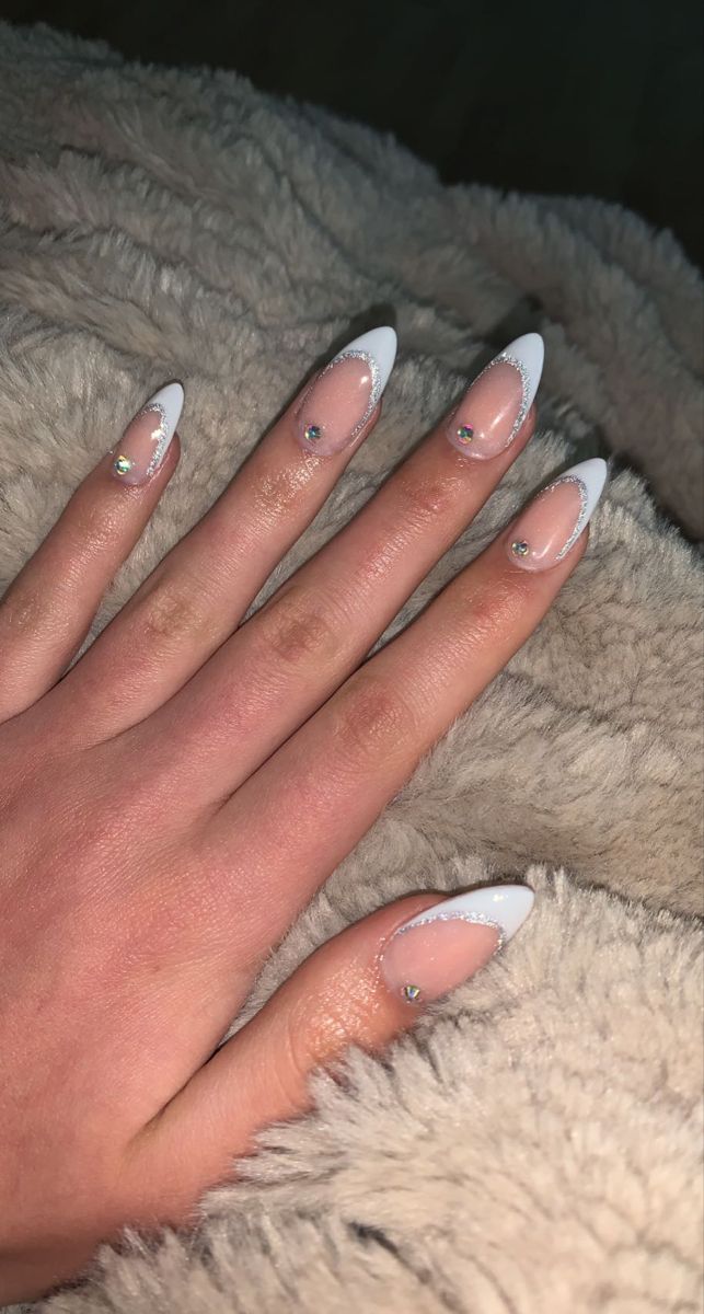 Elegant Stiletto Nails: Classic French Tips with Rhinestone Accents