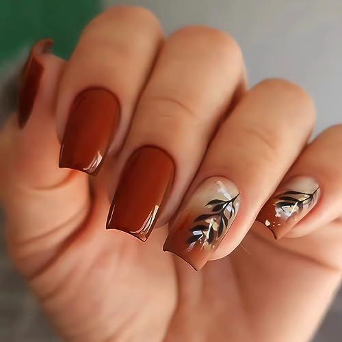 Elegant Brown Nail Design with Leaf Patterns and Glossy Finish.