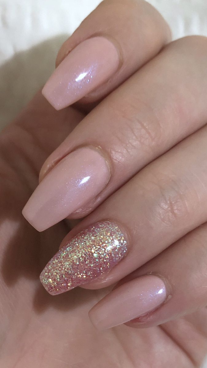 Chic Nude Nail Design with Glossy Finish and Sparkling Accent.