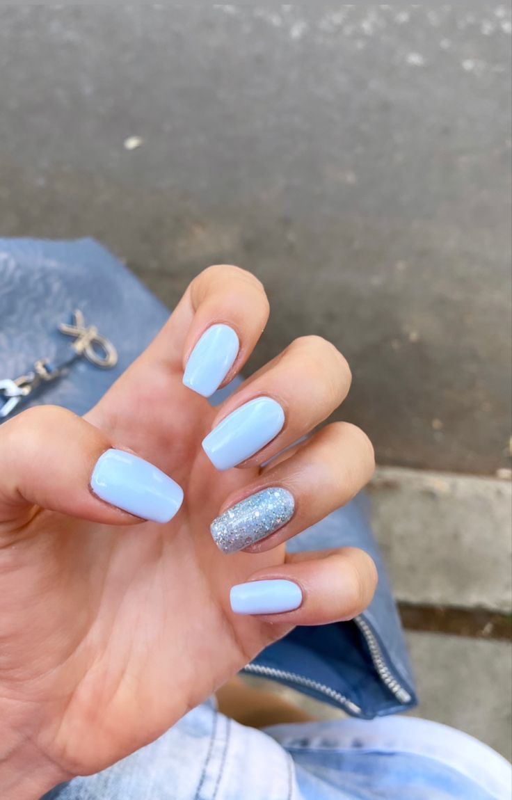 Chic Pastel Blue Nail Design with Shimmering Silver Glitter Accent