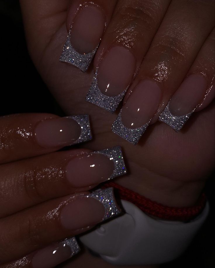 Elegant Long Nails with Glittery French Tips: A Perfect Blend of Classic and Modern Design.