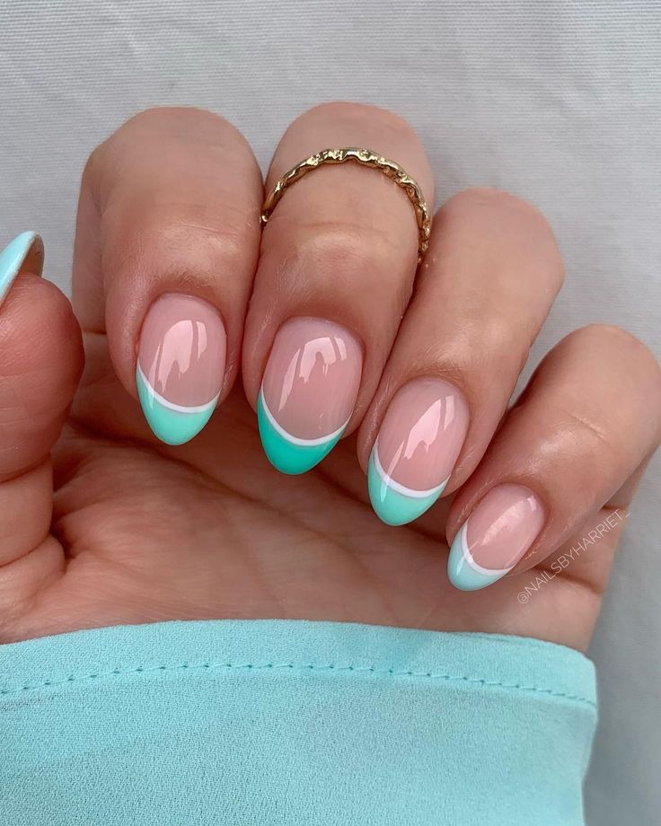 Modern French Tip Nail Design: Soft Pink Base with Striking Mint Green Tips.