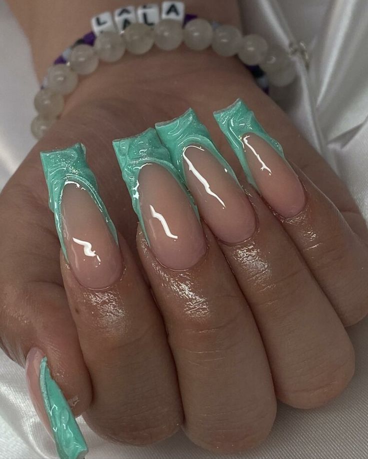 Striking Nail Design: Soft Nude Meets Vibrant Mint Green with Glossy Accents for a Bold Statement.