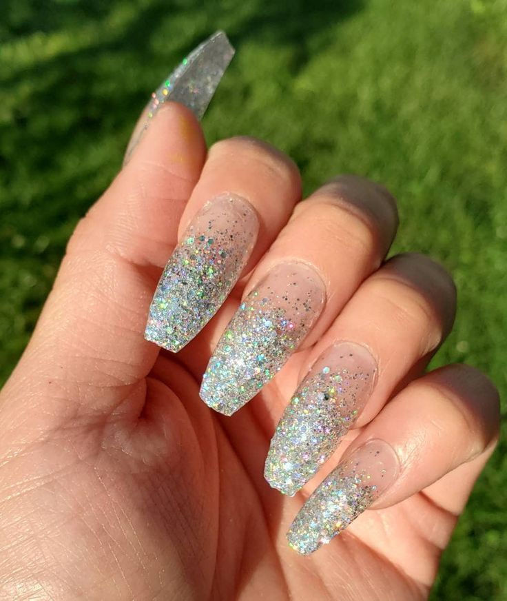 Chic Glittery Nail Design with Translucent Tips and Holographic Accents