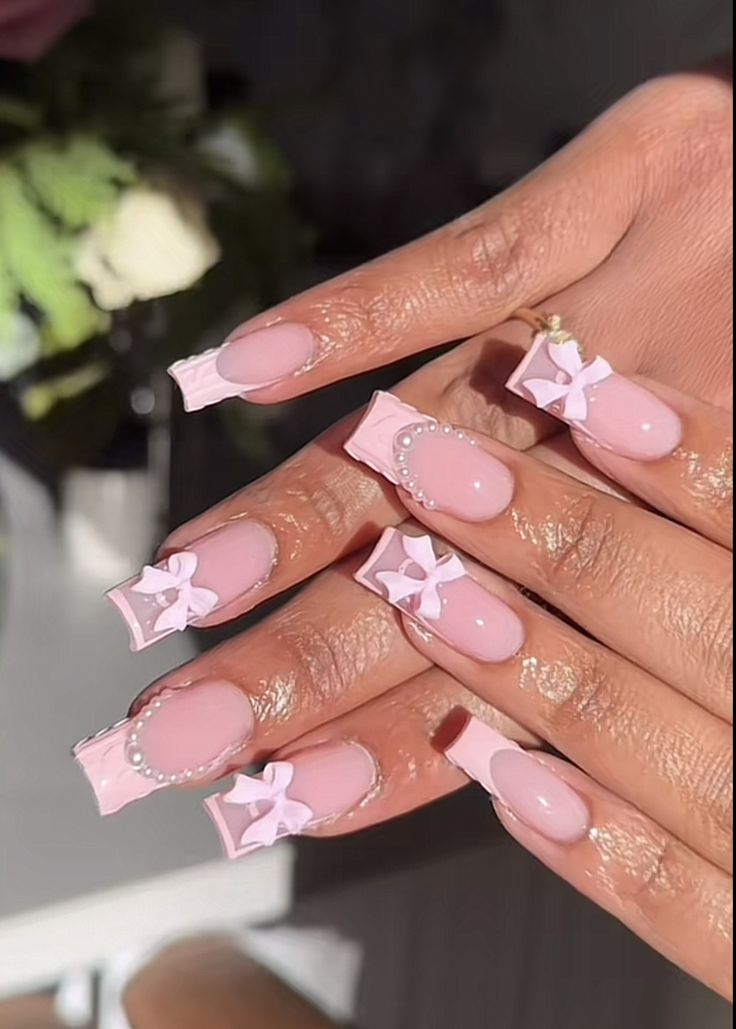 Chic Soft Pink Nail Design with 3D Bow and Pearl Accents