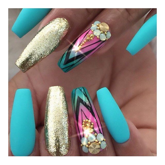 Eye-Catching Nail Design: Turquoise and Gold with Bold Chevron Stripes and Gemstones.