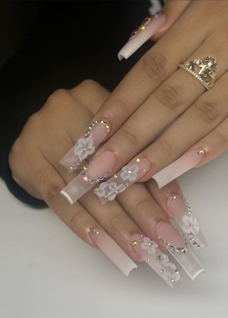 Chic Floral Acrylic Nail Design with Soft Pink and Sparkling Rhinestones.