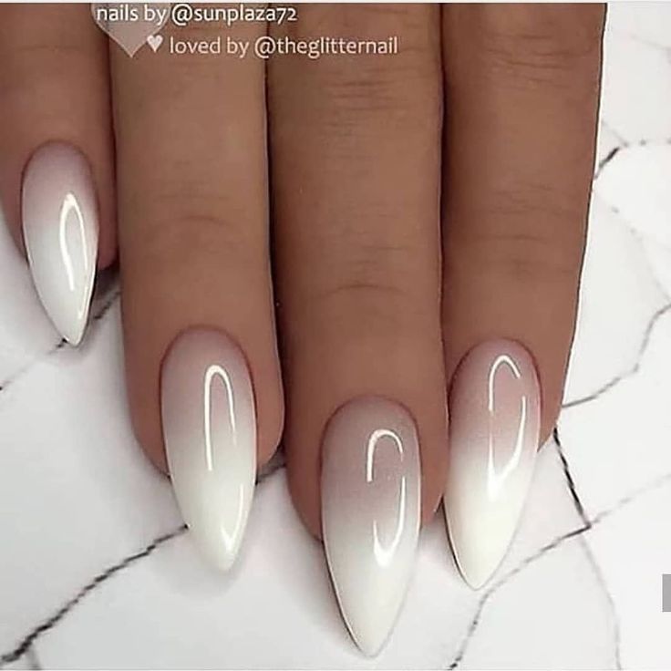 Sophisticated Elegant Ombre Stiletto Nails: A Stylish Blend of Soft Pink and Crisp White.