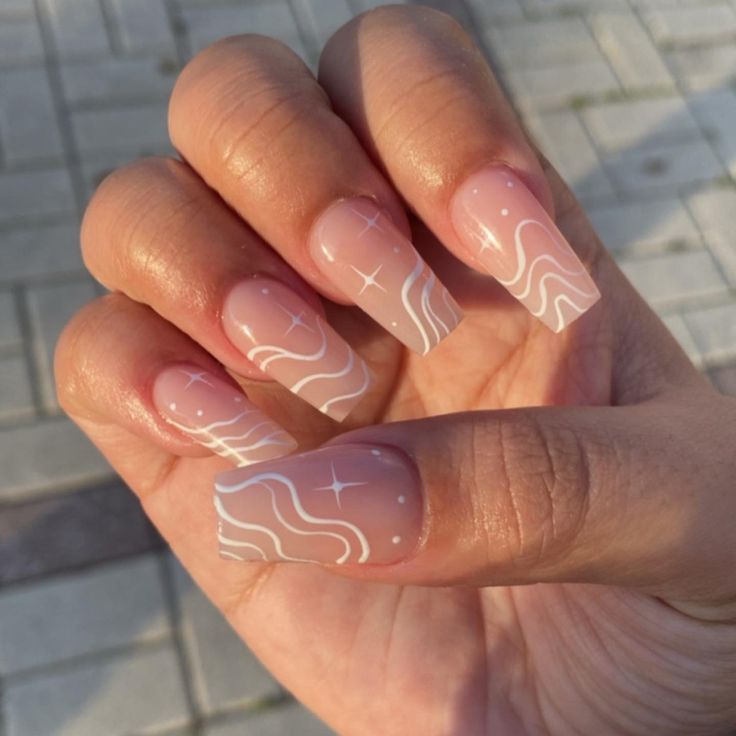 Chic Elegant Nude Nails with White Waves and Star Accents for Any Occasion.