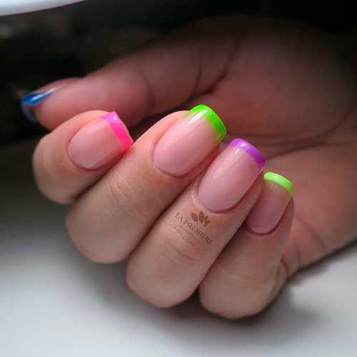 Vibrant Neon-Tipped French Manicure: A Playful Fusion of Classic Elegance and Modern Flair.