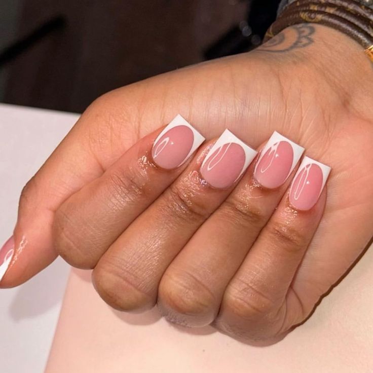 Chic Soft Pink and White French Manicure with Artistic Swirls and Dots.