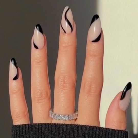 Sophisticated Chic Almond-Shaped Nails with Striking Black Lines on a Nude Base.