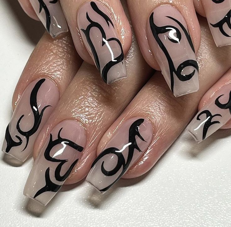 Modern Glossy Nude Nail Design with Intricate Black Tribal Patterns