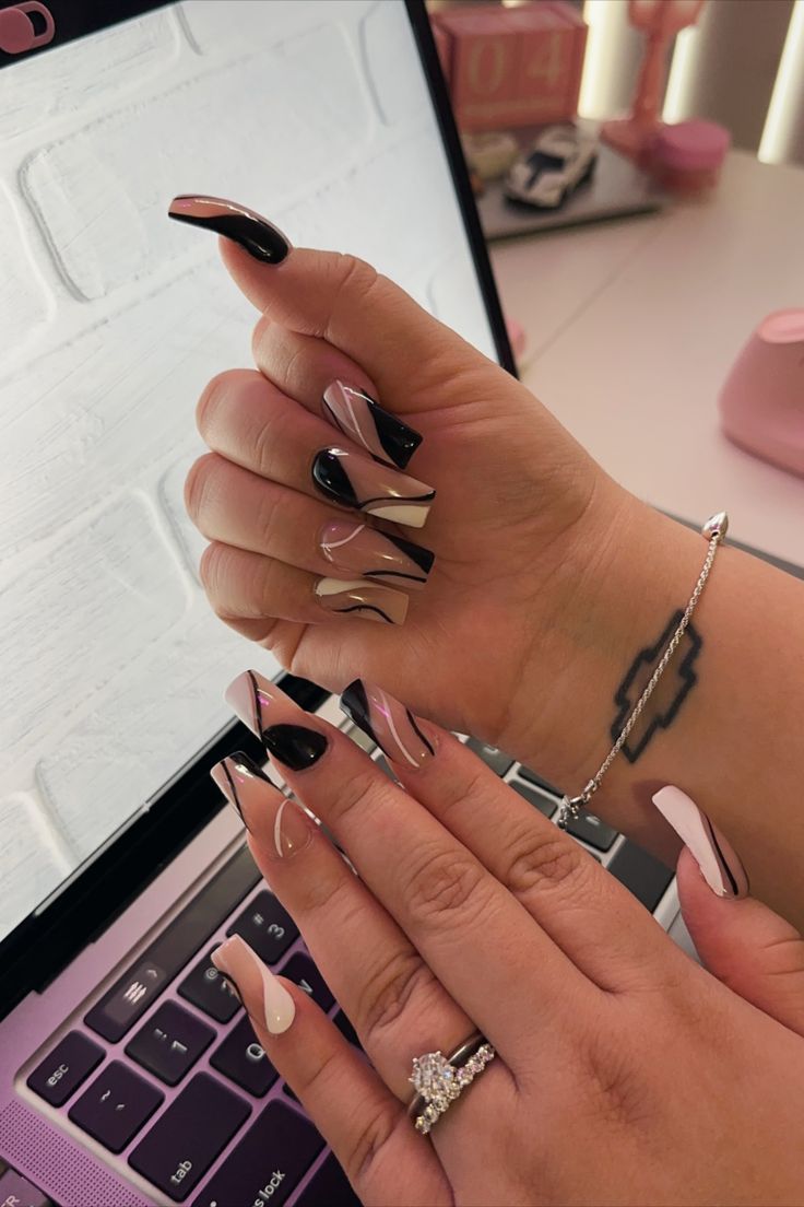 Elegant Nail Design Blending Black, Nude, and White with Unique Patterns