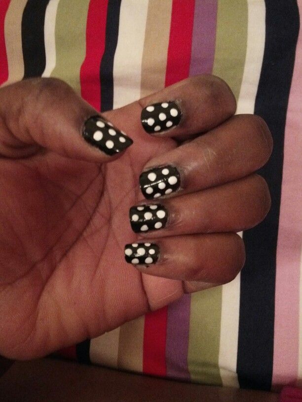 Bold Polka Dot Nail Design: Chic Sophistication with a Playful Edge.