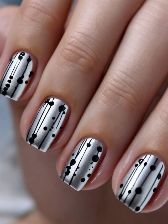 Chic Metallic Silver Nail Design with Modern Abstract Patterns.