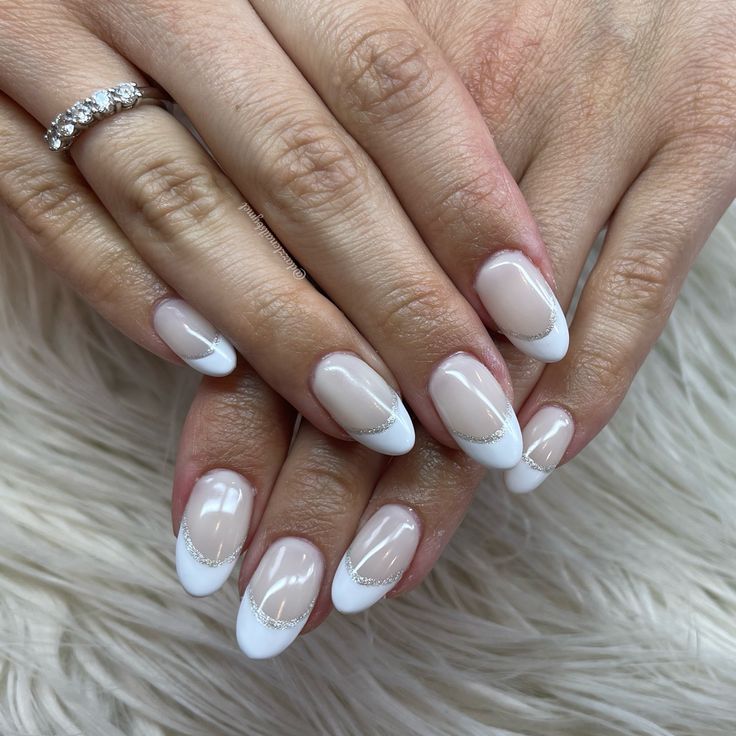 Chic Modern French Tip Nails with Delicate Gold Accents