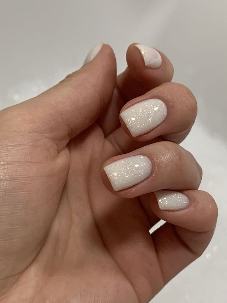 Sophisticated White Glitter Nail Design for Versatile Elegance.