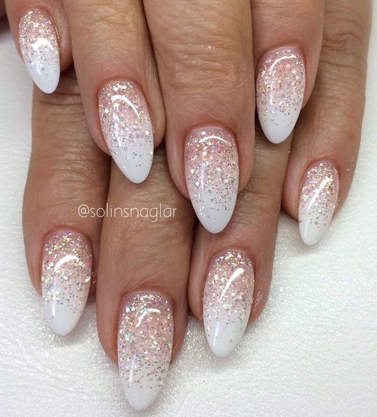 Elegant Ombre Nail Design: Soft White to Sparkling Glitter with Almond Shape