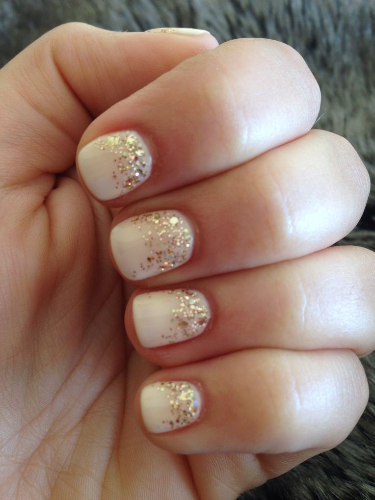 Sophisticated White and Gold Glitter Gradient Nail Design.