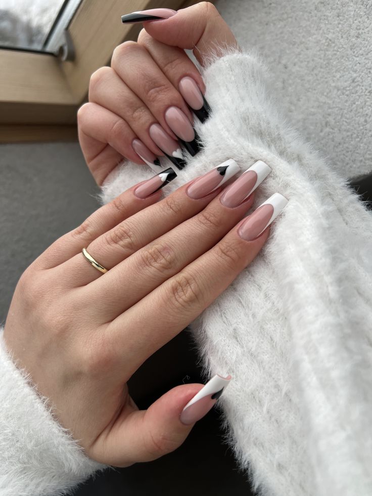 Chic Ombre Nail Design: Nude, White, and Black Tips for Elegance and Sophistication.