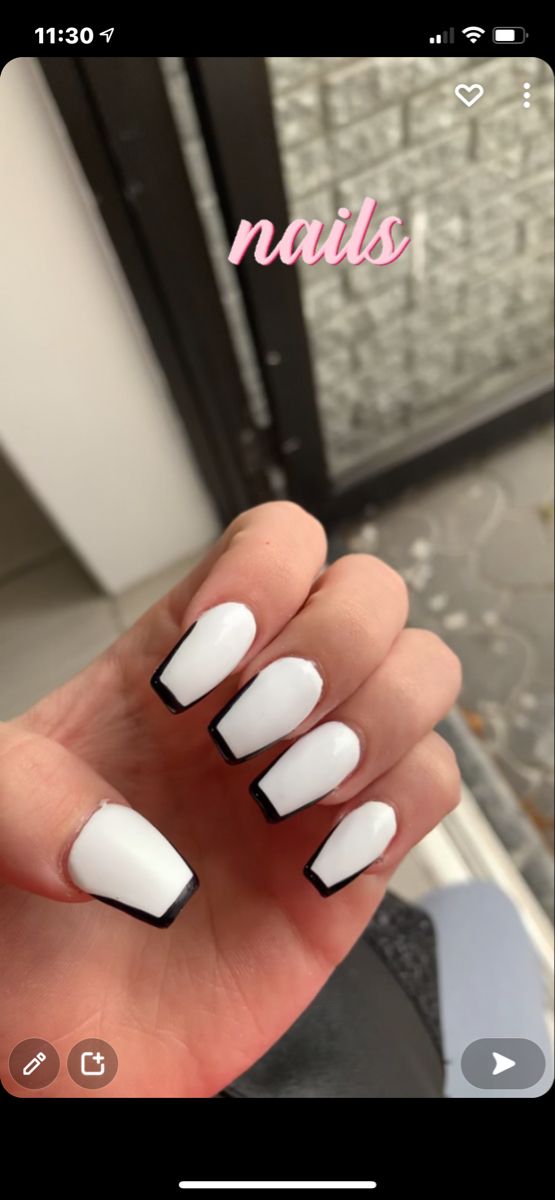 Modern Chic Nail Design: Classic White Base with Bold Black Tips