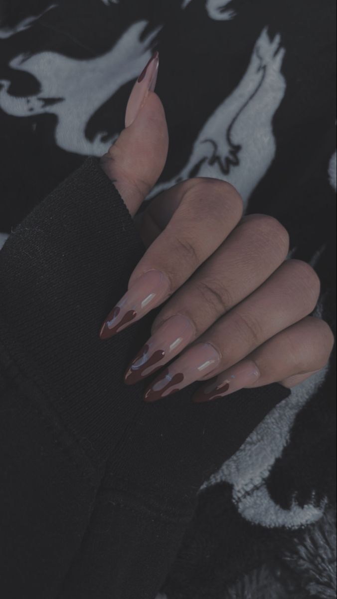 Chic Almond-Shaped Nails: Nude Base Enhanced with Artistic Deep Burgundy Drips.