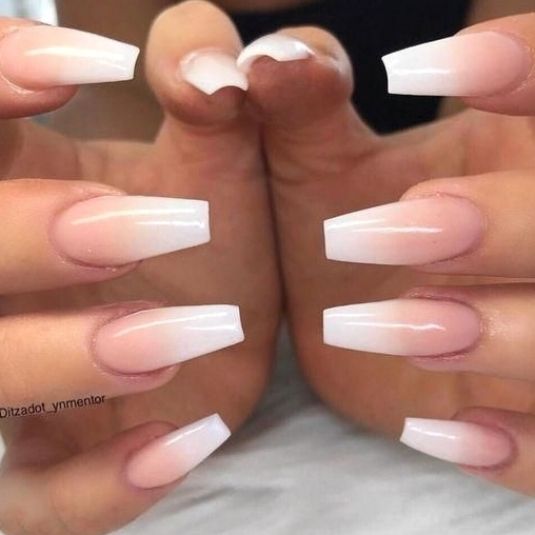 Chic Ombre Nail Design: Soft Pink to Translucent White Gradient on Elongated Square Nails.